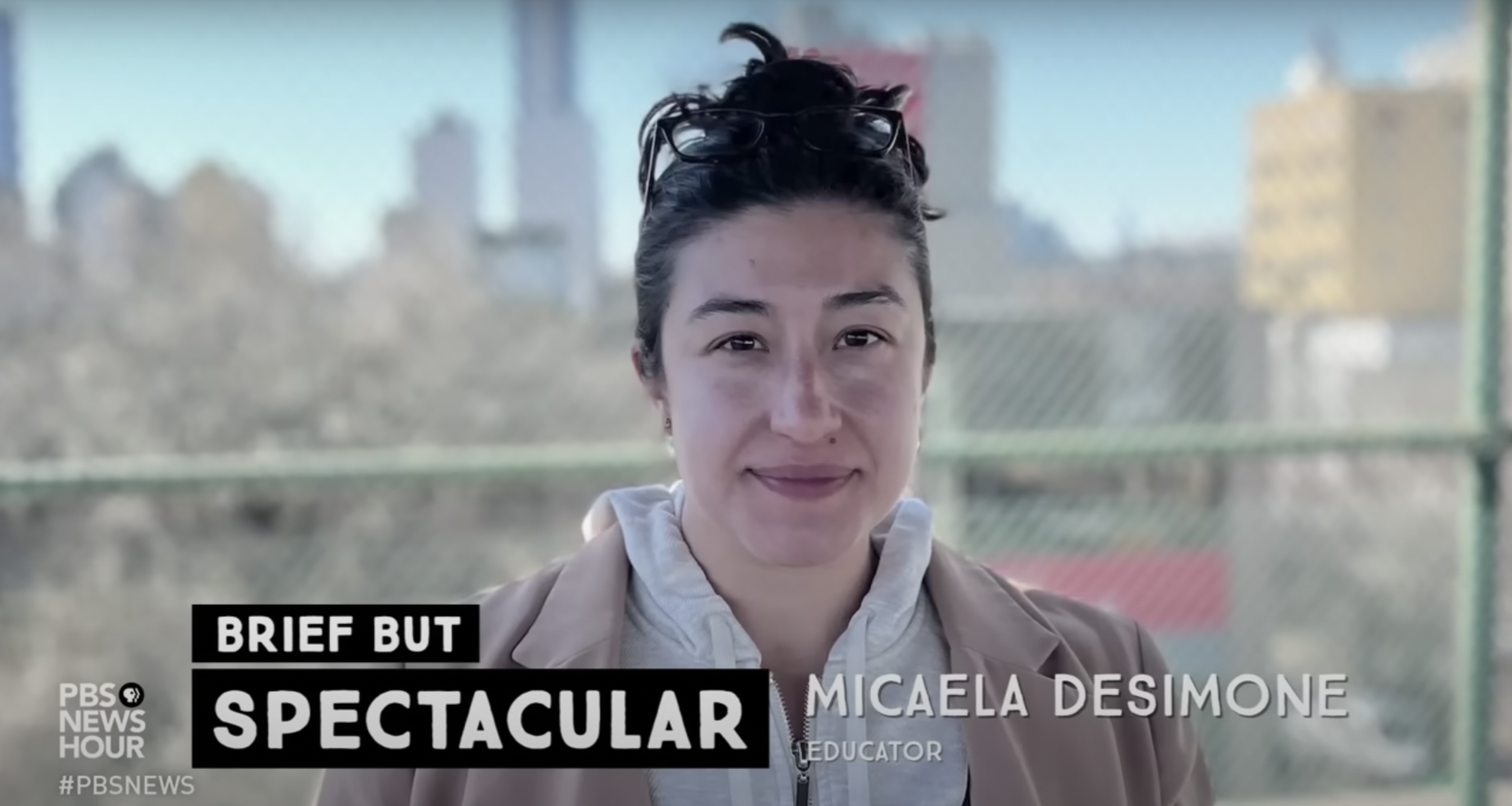 A screenshot of the PBS Documentary on teacher burnout shows educator Micaela Desimone smiling at the camera during an interview