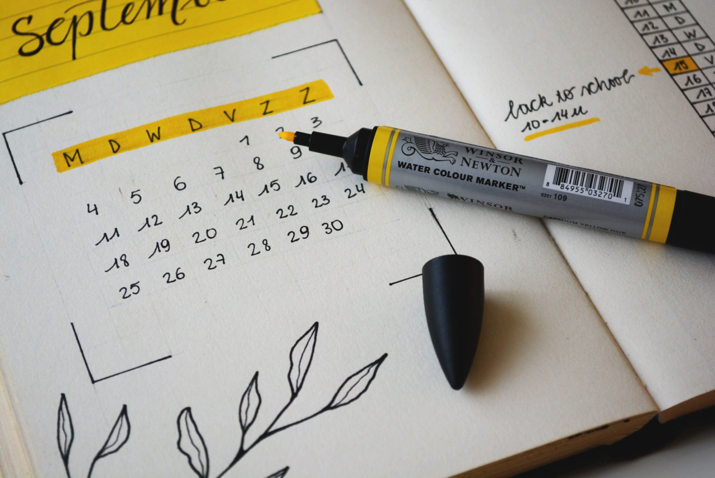 Photo of a hand drawn calendar with a yellow highlighter